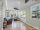 Relaxing sunroom with wicker furniture, tile floors, and multiple windows at 2625 Croydon Rd, Charlotte, NC 28209