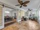 Bright sunroom with tile floors, wicker chairs, and French doors leading to the backyard at 2625 Croydon Rd, Charlotte, NC 28209