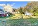 Large backyard with shed and neighbor's house visible at 2648 Roslyn Ave, Charlotte, NC 28208