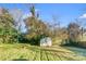 Landscaped backyard with shed and grassy area at 2648 Roslyn Ave, Charlotte, NC 28208