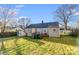 Spacious backyard with grassy area and storage at 2648 Roslyn Ave, Charlotte, NC 28208