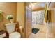 Bathroom with toilet, tub shower, and linen closet at 2648 Roslyn Ave, Charlotte, NC 28208