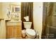 Clean bathroom with toilet, sink, and shower at 2648 Roslyn Ave, Charlotte, NC 28208