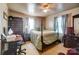 Bedroom with a double bed, dresser, and a ceiling fan at 2648 Roslyn Ave, Charlotte, NC 28208