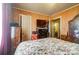 Bedroom with floral bedding and wood furniture at 2648 Roslyn Ave, Charlotte, NC 28208