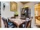 Small dining area with granite table and four chairs at 2648 Roslyn Ave, Charlotte, NC 28208