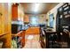 Bright kitchen with wood cabinets, laminate countertops, and a dining area at 2648 Roslyn Ave, Charlotte, NC 28208