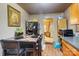 Cozy kitchen with granite-top table and view into living room at 2648 Roslyn Ave, Charlotte, NC 28208