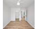 Bright bedroom featuring hardwood floors and ample closet space at 311 Drury Dr, Charlotte, NC 28206