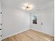 Bright and airy bedroom with light wood floors and a window at 311 Drury Dr, Charlotte, NC 28206