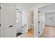 Upstairs hallway with doors to bedrooms and a bathroom at 311 Drury Dr, Charlotte, NC 28206