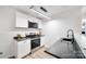 Modern kitchen with stainless steel appliances and dark countertops at 311 Drury Dr, Charlotte, NC 28206