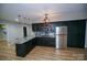 Basement kitchen with granite countertops and stainless steel appliances at 31934 Ameron Cir, Albemarle, NC 28001