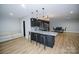 Basement kitchenette with granite countertops and dark cabinetry at 31934 Ameron Cir, Albemarle, NC 28001