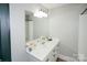 Simple bathroom with single vanity and a mirrored medicine cabinet at 31934 Ameron Cir, Albemarle, NC 28001