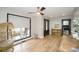 Hardwood floor entryway, featuring a black door and wicker chair at 31934 Ameron Cir, Albemarle, NC 28001