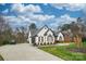 White brick house with brown accents and a long driveway at 31934 Ameron Cir, Albemarle, NC 28001