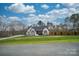 House with white brick and brown accents, large yard at 31934 Ameron Cir, Albemarle, NC 28001