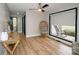 Bright hallway with hardwood floors and a cozy chair at 31934 Ameron Cir, Albemarle, NC 28001