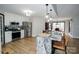 Spacious kitchen featuring granite countertops, stainless steel appliances, and an island at 31934 Ameron Cir, Albemarle, NC 28001