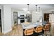 Modern kitchen with granite island, stainless steel appliances, and white cabinets at 31934 Ameron Cir, Albemarle, NC 28001