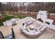 Stone patio with built-in seating and firepit at 31934 Ameron Cir, Albemarle, NC 28001