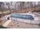 Relaxing pool with a safety cover and a basketball hoop at 31934 Ameron Cir, Albemarle, NC 28001