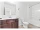 Simple bathroom with dark brown vanity and shower/tub combo at 3220 Capitol Dr, Charlotte, NC 28208