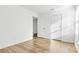 Spacious bedroom with wood flooring and an adjacent door at 3220 Capitol Dr, Charlotte, NC 28208