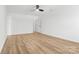 Bright bedroom featuring wood-look floors and a ceiling fan at 3220 Capitol Dr, Charlotte, NC 28208