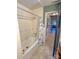 Bathroom with bathtub, shower, and view of hallway at 3720 Fairlane Dr, Gastonia, NC 28056