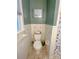 Small bathroom with toilet and tiled walls at 3720 Fairlane Dr, Gastonia, NC 28056