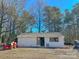 White detached garage with double doors and window at 3720 Fairlane Dr, Gastonia, NC 28056