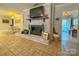 Whitewashed brick fireplace as a focal point in the living area at 3720 Fairlane Dr, Gastonia, NC 28056