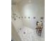 Shower stall with tile surround and a storage rack at 3720 Fairlane Dr, Gastonia, NC 28056