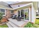Cozy back deck area with seating, perfect for outdoor relaxation and entertaining with access to the sunroom at 3828 Chandworth Rd, Charlotte, NC 28210