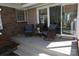 Relaxing back porch offers a cozy outdoor retreat with comfortable swivel chairs and access to the yard at 3828 Chandworth Rd, Charlotte, NC 28210