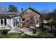 Enjoy the cozy backyard deck with outdoor seating and an umbrella table, ideal for relaxing or entertaining outdoors at 3828 Chandworth Rd, Charlotte, NC 28210