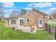 Expansive backyard with a well-maintained lawn and a charming wooden deck, ideal for outdoor activities and gatherings at 3828 Chandworth Rd, Charlotte, NC 28210