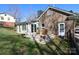 A nice backyard with a deck and outdoor seating provides a relaxing space with chairs, and a dining area at 3828 Chandworth Rd, Charlotte, NC 28210