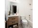 Clean bathroom boasts a modern vanity, tile floors, and a shower-tub combo at 3828 Chandworth Rd, Charlotte, NC 28210