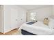 Bright bedroom featuring hardwood floors, a window, and two closets for ample storage space at 3828 Chandworth Rd, Charlotte, NC 28210