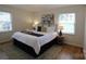 Cozy bedroom with a queen-size bed, plush pillows, and natural light from windows at 3828 Chandworth Rd, Charlotte, NC 28210