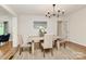 Charming dining room featuring hardwood floors and natural light at 3828 Chandworth Rd, Charlotte, NC 28210