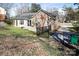 Exterior shot of a brick home with a backyard deck and fenced area at 3828 Chandworth Rd, Charlotte, NC 28210