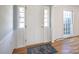 Bright foyer featuring a blue patterned rug and views of hardwood floors at 3828 Chandworth Rd, Charlotte, NC 28210