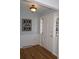 Bright foyer with hardwood floors, a stylish light fixture, and fresh, neutral paint at 3828 Chandworth Rd, Charlotte, NC 28210