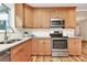 Updated kitchen featuring stainless steel appliances and hardwood floors at 3828 Chandworth Rd, Charlotte, NC 28210