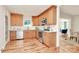 Well-lit kitchen with stainless steel appliances and wood cabinets at 3828 Chandworth Rd, Charlotte, NC 28210