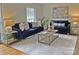 Cozy living room featuring hardwood floors, neutral walls, and comfortable seating at 3828 Chandworth Rd, Charlotte, NC 28210